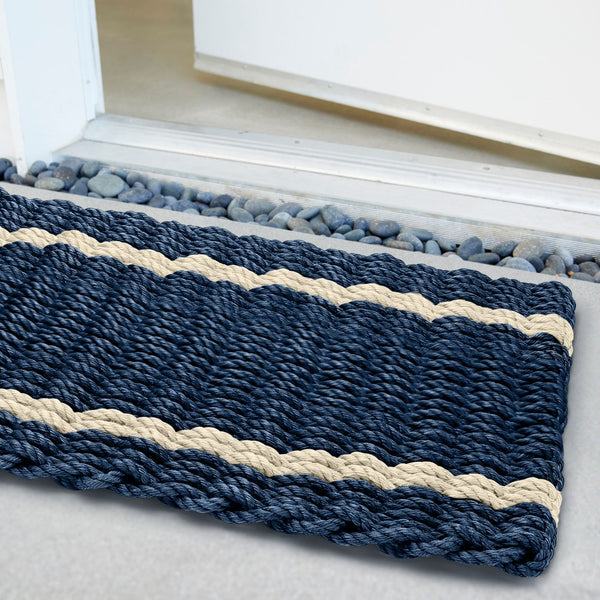 Weatherproof and fade-resistant doormat with subtle stripe pattern, crafted for year-round outdoor use.