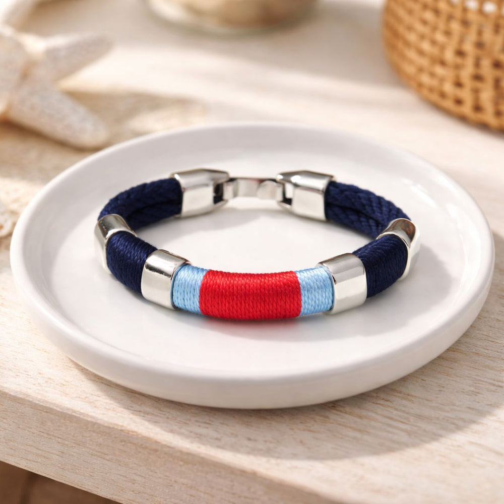 Hand-dyed cotton rope bracelet with silver-plated clasp and spacer beads, inspired by coastal style.