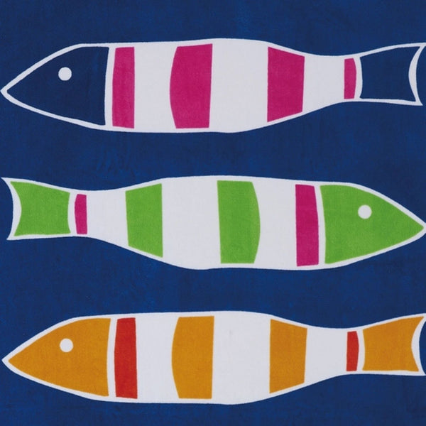 Close-up of colorful striped fish pattern on blue cotton beach towel
