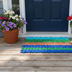 Sustainable rope doormat crafted from recycled materials, featuring a strong weave and coastal-inspired design
