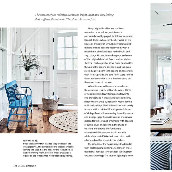 A minimalist interior that celebrates simplicity, the bold blue chair stands out as a statement piece, grounded by a round textured rug. The clean white walls amplify natural light, giving the space a modern yet inviting feel.