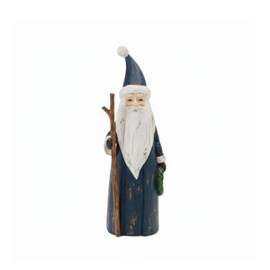 Handcrafted navy Santa with coastal holiday accents, including greenery and walking stick.