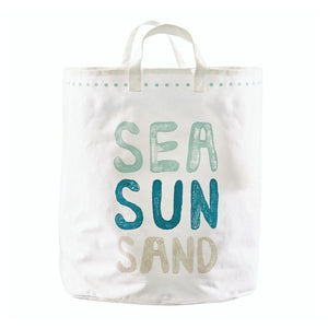 Oversized white canvas storage tote with Sea Sun Sand text in blue and sand tones