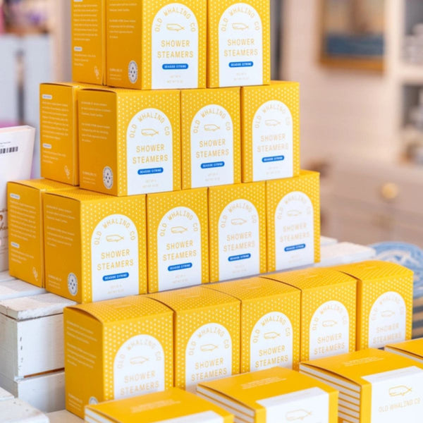 Boxed Seaside Citrine® candle with a lead-free cotton wick and nautical design, perfect for coastal gifting.