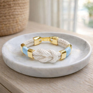 Handcrafted slip-on cotton rope bracelet with gold-plated details, inspired by coastal style.