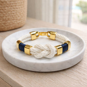 Handcrafted slip-on cotton rope bracelet with gold-plated details, inspired by coastal style.