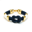 Slip-on cotton rope bracelet with gold-plated spacer beads and textured thread detail, comfortable everyday wear.
