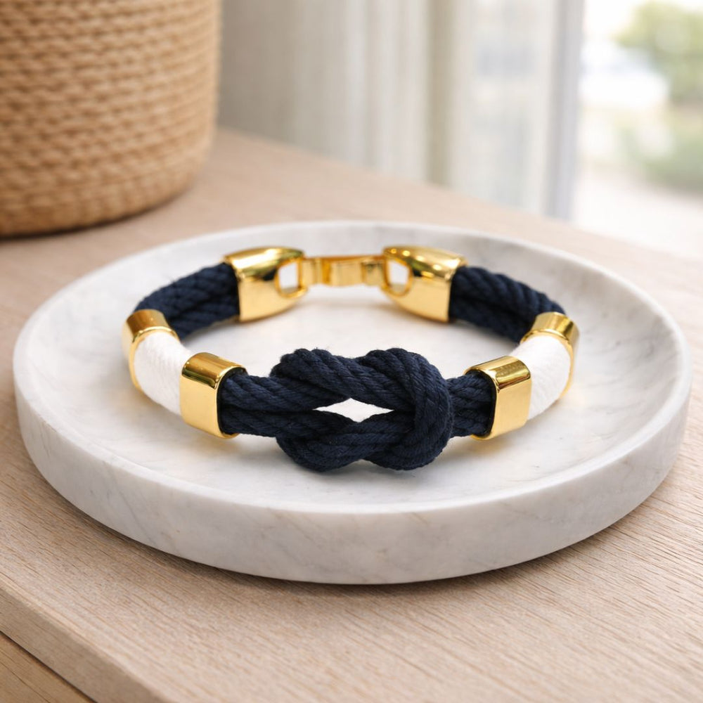 Slip-on cotton rope bracelet with gold-plated spacer beads and textured thread detail, comfortable everyday wear.