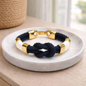 Slip-on cotton rope bracelet with gold-plated spacer beads and textured thread detail, comfortable everyday wear.