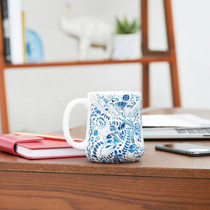 Ocean Blue Floral Coffee Mug in a table, coastal ceramic mug