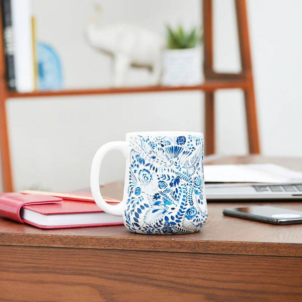 Ocean Blue Floral Coffee Mug in a table, coastal ceramic mug