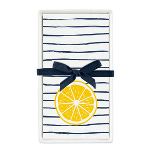 Ceramic guest napkin tray with striped lemon napkins tied with navy ribbon