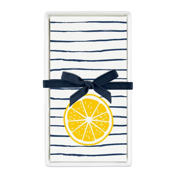 Ceramic guest napkin tray with striped lemon napkins tied with navy ribbon