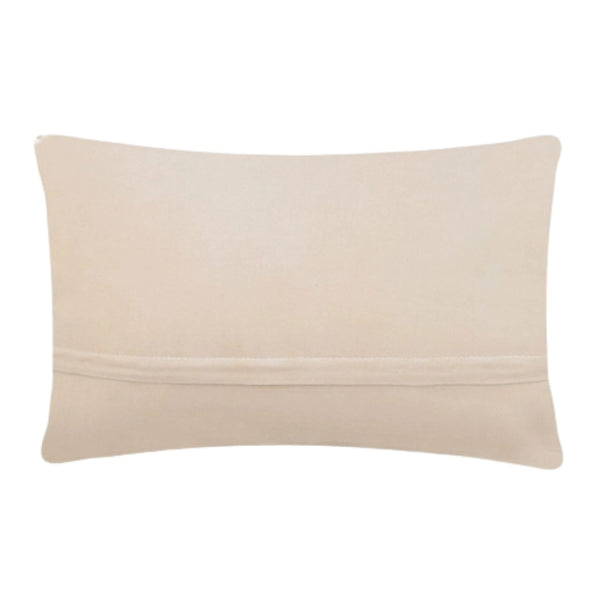 The reverse side of a coastal accent pillow showing smooth, solid cream-colored velvet fabric and a hidden horizontal zipper closure.