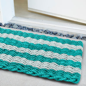 Bold, weatherproof doormat with cabana stripe design, perfect for coastal or modern entryways