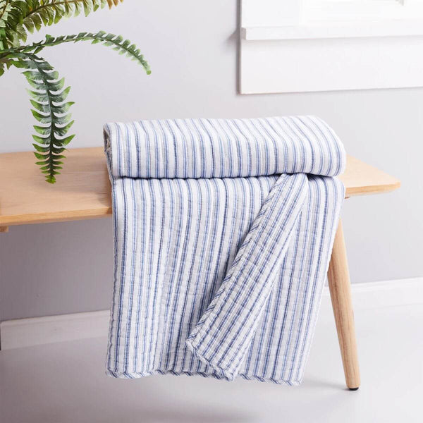 Reversible Tobago Stripe throw blanket in soft lightweight cotton with classic pinstripe design, ideal for beds or couches.
