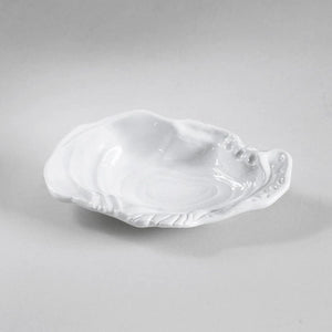 Small sculptural oyster shell bowl in white, heavy-weight melamine, indoor/outdoor friendly.