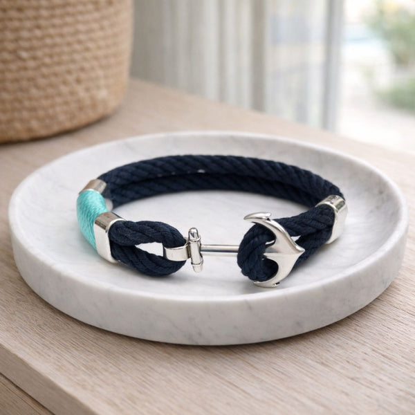 Summer-inspired nautical cotton rope bracelet featuring a silver-plated anchor clasp and spacer bead, versatile for layering.