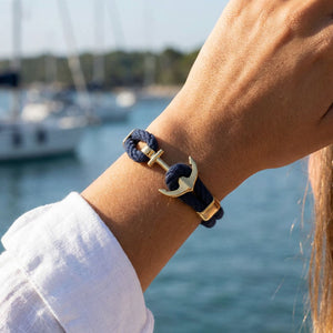 Nautical-inspired cotton rope bracelet with gold-plated anchor, lightweight and ideal for everyday wear or stacking.