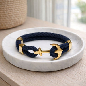 Nautical-inspired cotton rope bracelet with gold-plated anchor, lightweight and ideal for everyday wear or stacking.