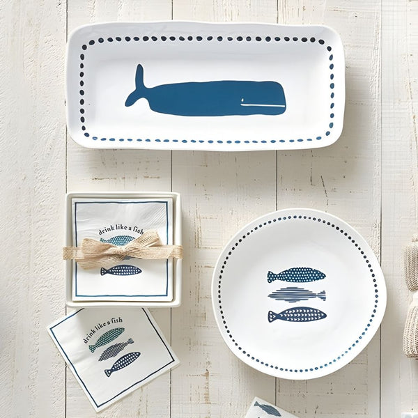 Blue whale melamine serving platter styled with coordinating coastal tableware