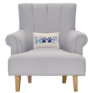 Woof paw print hooked wool lumbar pillow on upholstered chair