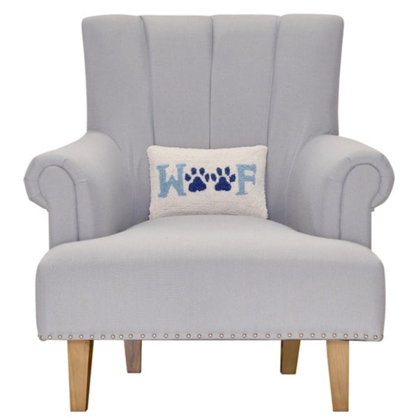 Woof paw print hooked wool lumbar pillow on upholstered chair