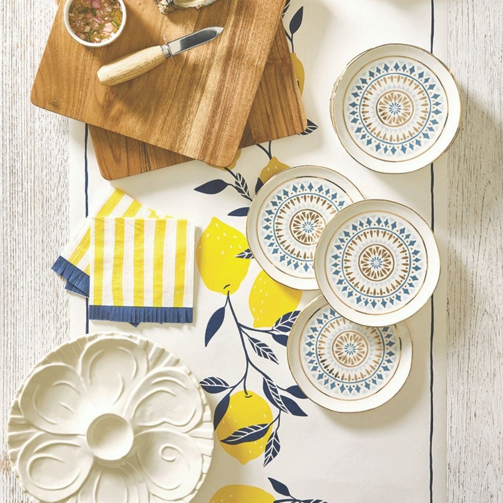 Yellow striped paper cocktail napkin with decorative fringe edge