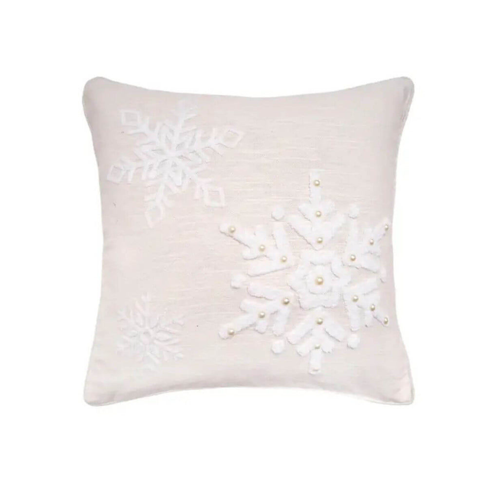 Embroidered linen-cotton throw pillow with delicate snowflakes, adding soft winter texture to home décor