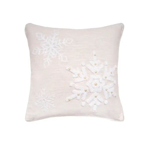 Embroidered linen-cotton throw pillow with delicate snowflakes, adding soft winter texture to home décor