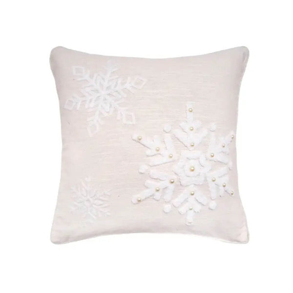 Embroidered linen-cotton throw pillow with delicate snowflakes, adding soft winter texture to home décor