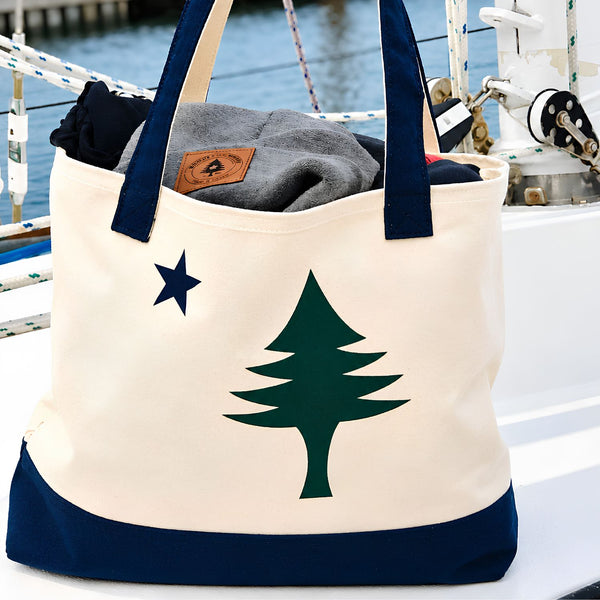 Natural Canvas Maine Flag Tote Bag With Navy Straps On A Boat, Nautical Canvas Carryall And Coastal Gift