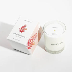 Coastal-inspired mermaid candle with golden amber, musk, citrus, lily of the valley, and pink jasmine scent, comes with a reusable tumbler glass