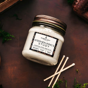 Nubble Light Candle Stephen King’s Study 8 oz Soy Wax Candle in White on a Rustic Dark Background with Matches, New England Candles, Literary Candles, Scented Jar Candles, Maine Candles