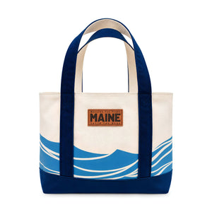 Natural Canvas Taste The Seas Maine Tote Bag With Blue Wave Design, Navy Handles And Base, Coastal Canvas Beach Bag, Maine-Themed Nautical Gift