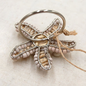 Closeup Of Natural Wood Bead And Twisted Metal Detail On Starfish Napkin Ring, Coastal Table Accessories And Beach House Decor